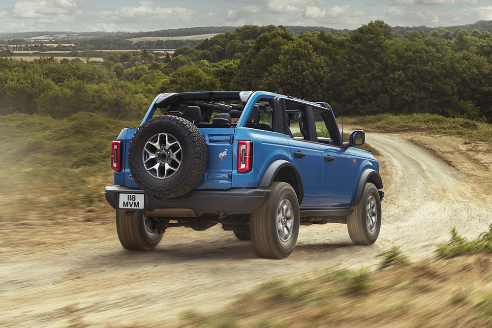 Ford Bronco driving through a small lake
