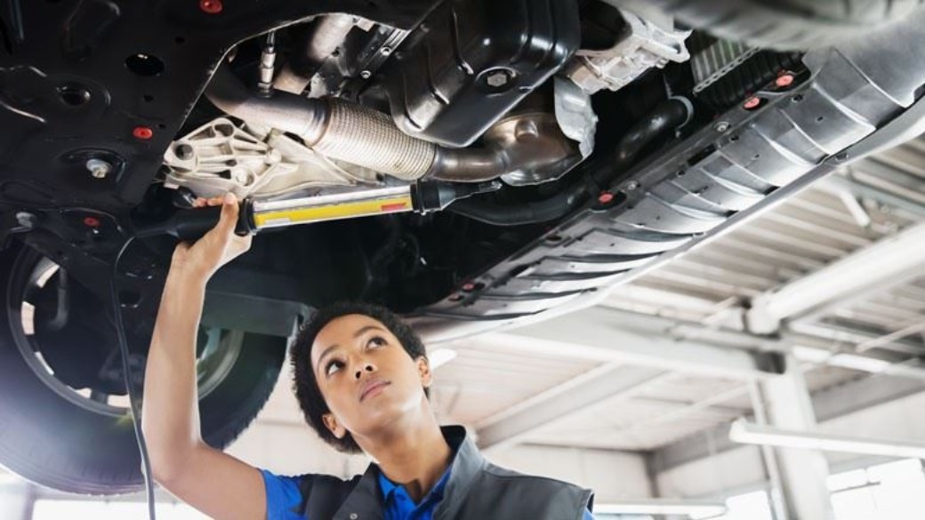 Ford-trained technician servicing a vehicle in the workshop
