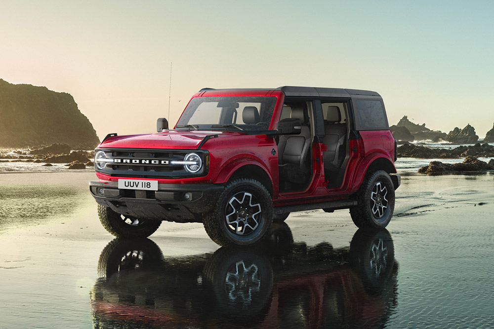 Ford Bronco parked on rocks in the desert mountains