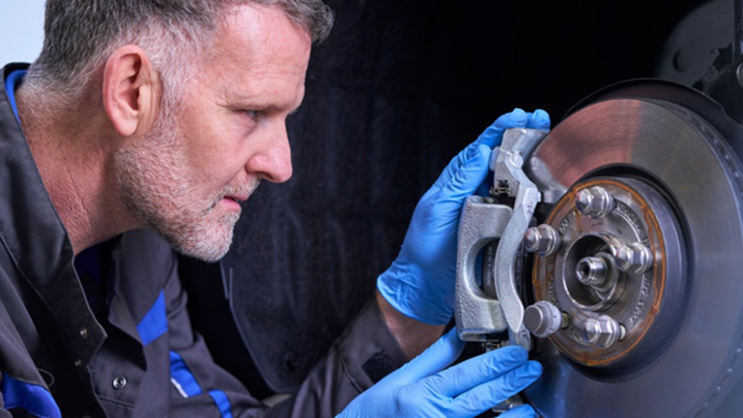 Ford technician carrying out a brake repair in the workshop