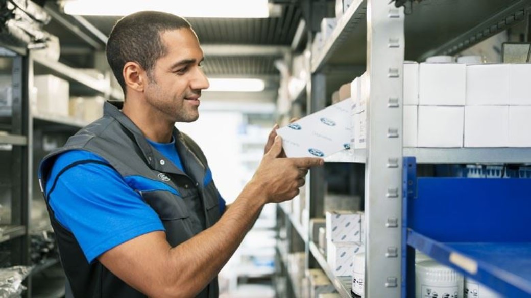 Genuine Ford parts on the shelves of a Ford parts department